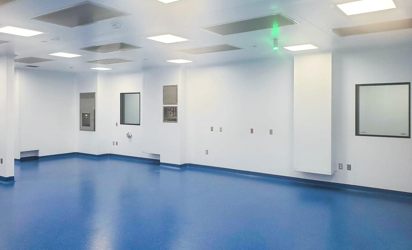 Inside of an empty POD cleanroom with blue flooring